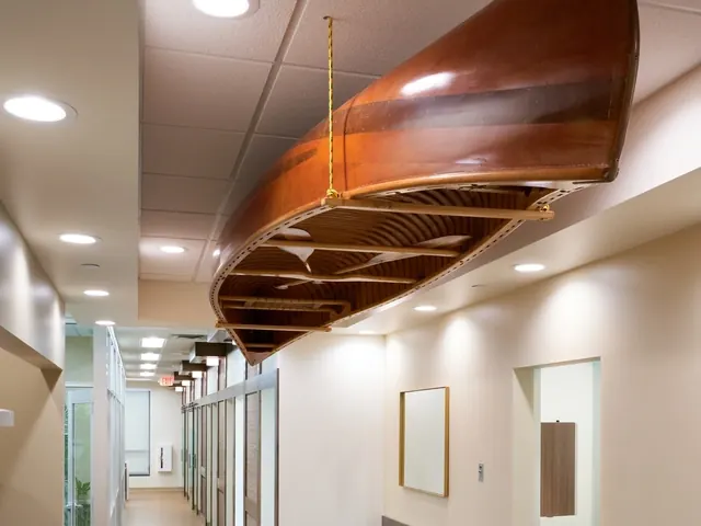 A wooden canoe hung from the ceiling of the corridor between treatment rooms.