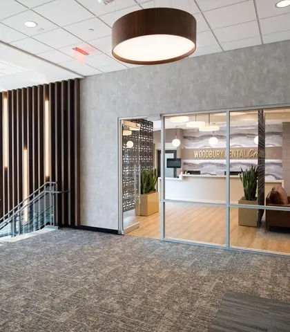 The second-floor landing and the glass doors into the practice.
